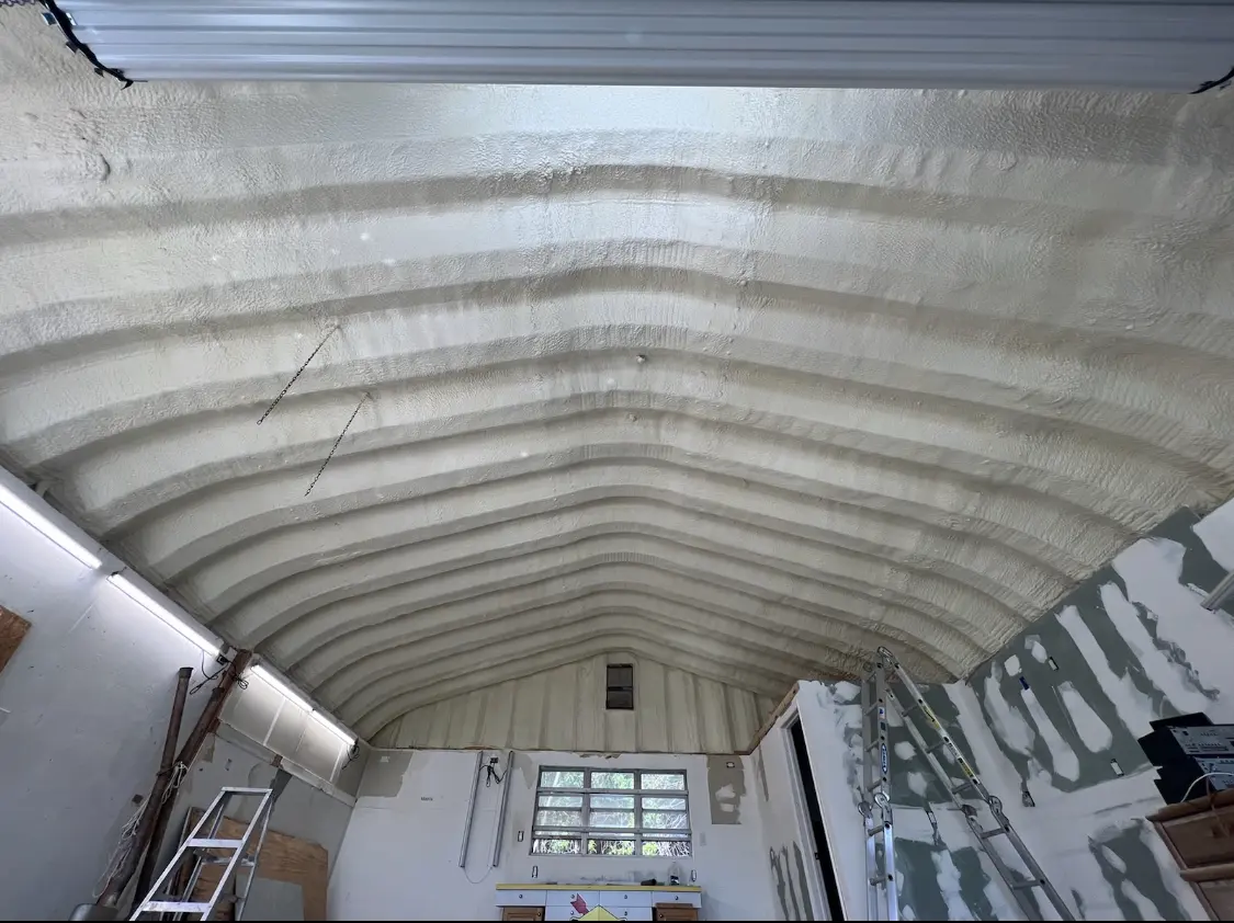 Spray polyurethane foam applied to the underside of a metal roof deck in Voorhees